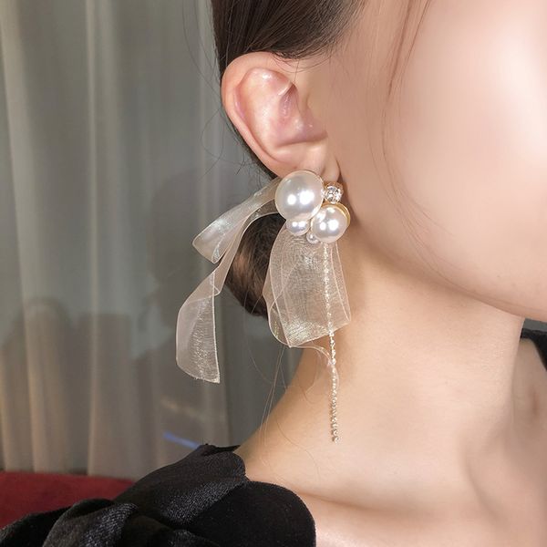 des boucles d'oreilles pearl bow ribbon long tassel silver pin earring earrings jewelry women designer earrings
des boucles d'oreilles pearl bow ribbon long tassel silver pin earring earrings jewelry women designer earrings