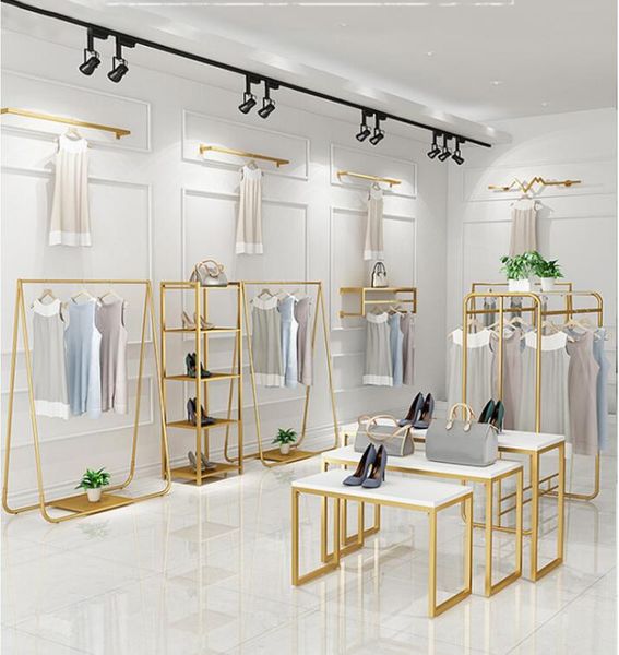 clothing store display rack floor combination gold women's cloth shop shelf iron hanging clothes racks
clothing store display rack floor combination gold women's cloth shop shelf iron hanging clothes racks