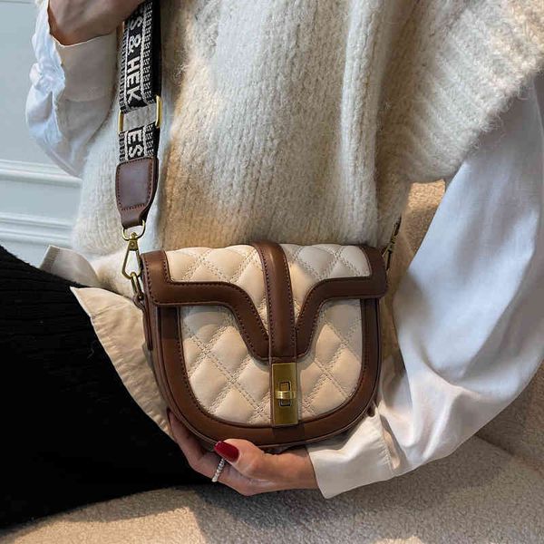 2022 factory wholesale new small female korean fashion semi-circular saddle bag foreign style simple wide shoulder belt contrast color singl
2022 factory wholesale new small female korean fashion semi-circular saddle bag foreign style simple wide shoulder belt contrast color singl