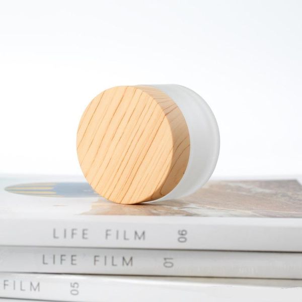 05 frosted glass jar cream bottles round cosmetic jars hand face packing bottles50g jars with wood grain cover
05 frosted glass jar cream bottles round cosmetic jars hand face packing bottles50g jars with wood grain cover
