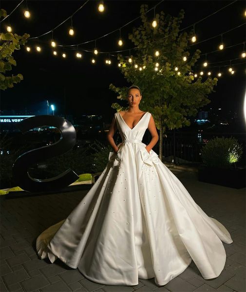 v neck a line wedding dresses with pocket bow pearls sweep train bridal gowns custom made modern style robes de mariée, White
v neck a line wedding dresses with pocket bow pearls sweep train bridal gowns custom made modern style robes de mariée, White