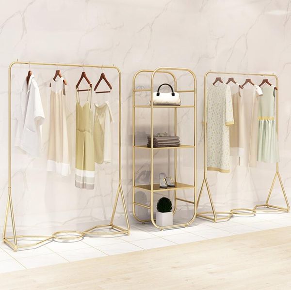 clothing store display rack children furniture floor type cloth shop show stand gold iron clothes racks side hanging 
clothing store display rack children furniture floor type cloth shop show stand gold iron clothes racks side hanging