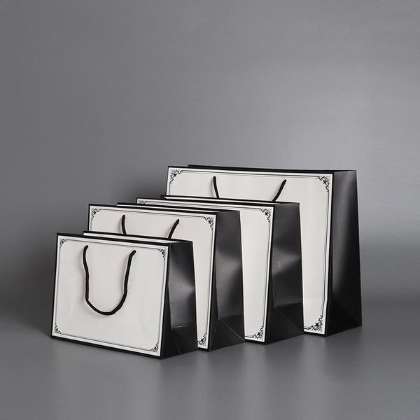 gift wrap creative paper bags boxes with string for shopping outdoor portable case bag handles
gift wrap creative paper bags boxes with string for shopping outdoor portable case bag handles