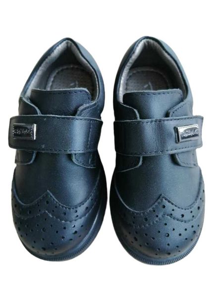 athletic & outdoor a sleek, glossy black leather shoe worn by tyrannis children's boys
athletic & outdoor a sleek, glossy black leather shoe worn by tyrannis children's boys