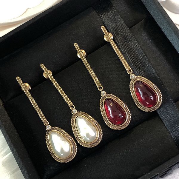 new dangle vintage ruby pearl tassel pendant asymmetric ear studs luxury personality women's earrings, Silver
new dangle vintage ruby pearl tassel pendant asymmetric ear studs luxury personality women's earrings, Silver