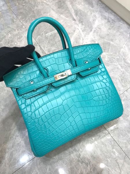 by order only,whosale beautiful fully handmade quality design crocodile handbag,25cm,wax stitiching,also can make other size,,fast delivery
by order only,whosale beautiful fully handmade quality design crocodile handbag,25cm,wax stitiching,also can make other size,,fast delivery