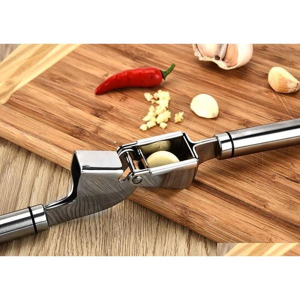 stainless steel garlic press crusher ginger tool kitchen hand movement mincer garlic peeler ginger crus jlllif dhsybaby 
stainless steel garlic press crusher ginger tool kitchen hand movement mincer garlic peeler ginger crus jlllif dhsybaby