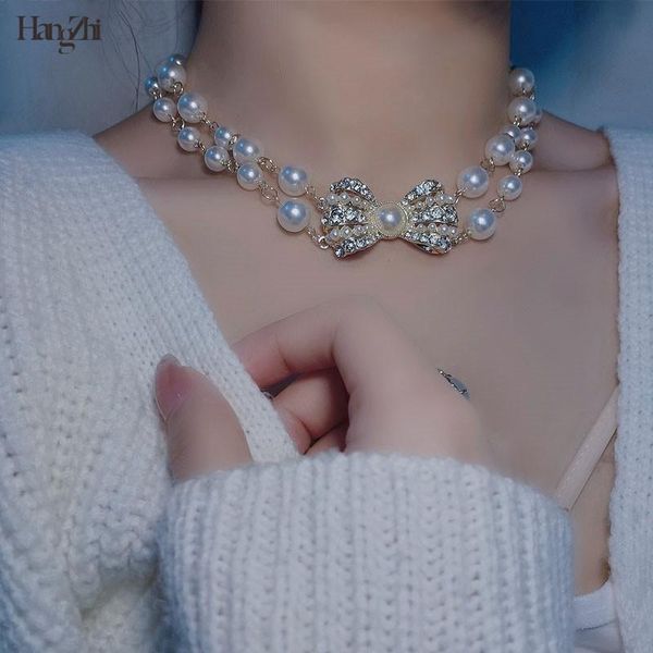 women clavicle chain double-layer pearl short snake bone necklace jewelry fashion exaggerated full zircon artificial pearl bow, Golden;silver
women clavicle chain double-layer pearl short snake bone necklace jewelry fashion exaggerated full zircon artificial pearl bow, Golden;silver