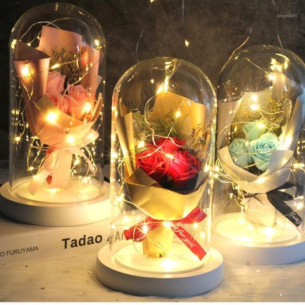 a bunch of red rose artificial flowers in a glass dome on white base home decoration for valentine's gifts mother day gift1
a bunch of red rose artificial flowers in a glass dome on white base home decoration for valentine's gifts mother day gift1