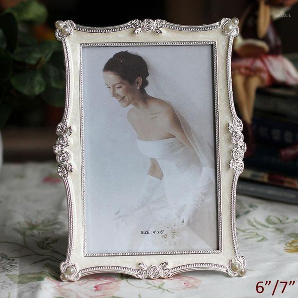 wedding accents european style rose flowers design shiny silver plating with white epoxy and pearls jeweled metal picture frame1
wedding accents european style rose flowers design shiny silver plating with white epoxy and pearls jeweled metal picture frame1