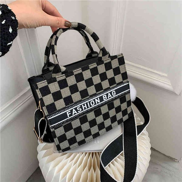 plaid wool tweed high capacity tote women's fashion commuter this year wide shoulder strap single shoulder portable messenger
plaid wool tweed high capacity tote women's fashion commuter this year wide shoulder strap single shoulder portable messenger
