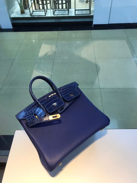 fully handmade,25cm brand bag,touch purse with crocodile handle,deep blue color,wax line stiching,can make other size too,contact for more d
fully handmade,25cm brand bag,touch purse with crocodile handle,deep blue color,wax line stiching,can make other size too,contact for more d