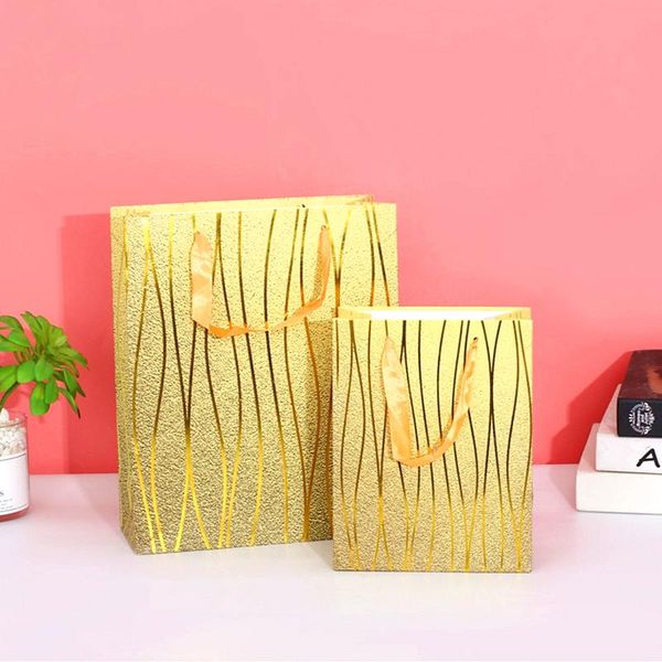golden gift bag with gilding stripes, for birthday wedding, christmas, graduation, baby shower gift bag
golden gift bag with gilding stripes, for birthday wedding, christmas, graduation, baby shower gift bag