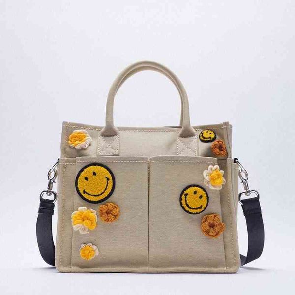 shopping bags smile icon decoration canvas handbag new women's beige large capacity messenger female purse 220307
shopping bags smile icon decoration canvas handbag new women's beige large capacity messenger female purse 220307