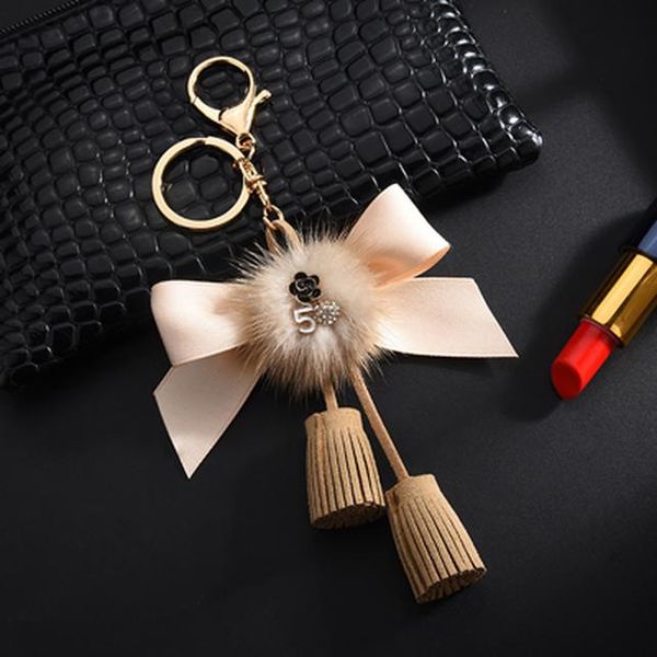 новый tassle bow узел ключ цепь с молочным мехом для женщин для женщин автомобильные сумка ключ держатель llaveros chaveiros porte clef ювел
новый tassle bow узел ключ цепь с молочным мехом для женщин для женщин автомобильные сумка ключ держатель llaveros chaveiros porte clef ювел