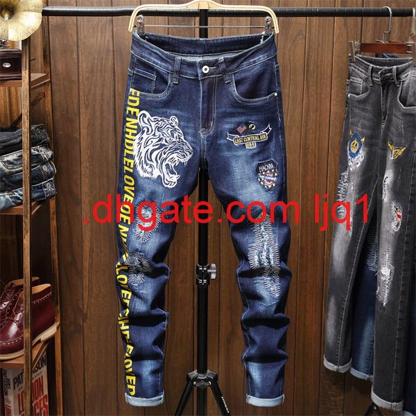 autumn and winter new men's jeans tiger head embroidery printing blue slim hole pants fashion
autumn and winter new men's jeans tiger head embroidery printing blue slim hole pants fashion