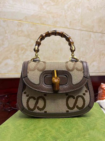 net red same bamboo printed hand saddle single shoulder messenger spring and summer women's trend
net red same bamboo printed hand saddle single shoulder messenger spring and summer women's trend