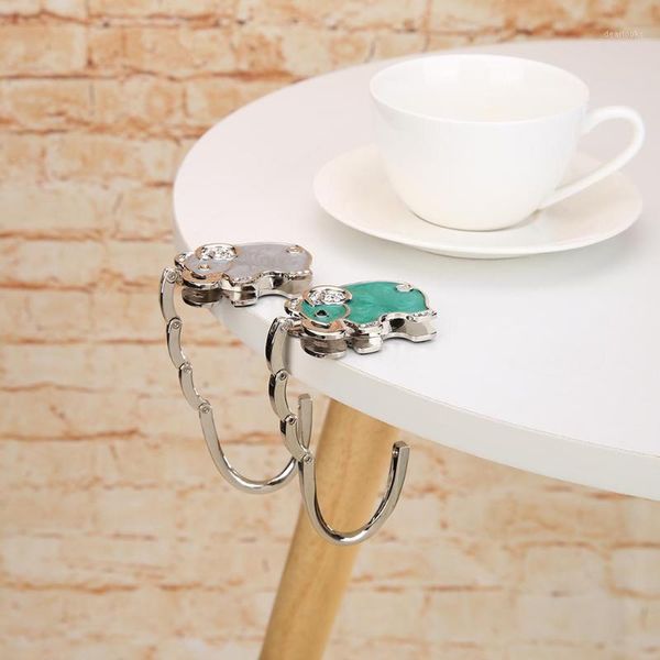 portable foldable bag purse hook handbag hanger zinc alloy purse hook handbag holder shell bag folding table1
portable foldable bag purse hook handbag hanger zinc alloy purse hook handbag holder shell bag folding table1
