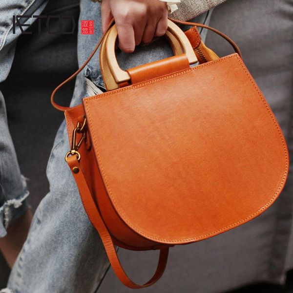 aetoo vintage wooden handle handbag, female leather shoulder crossbody bag, literary saddle pack
aetoo vintage wooden handle handbag, female leather shoulder crossbody bag, literary saddle pack