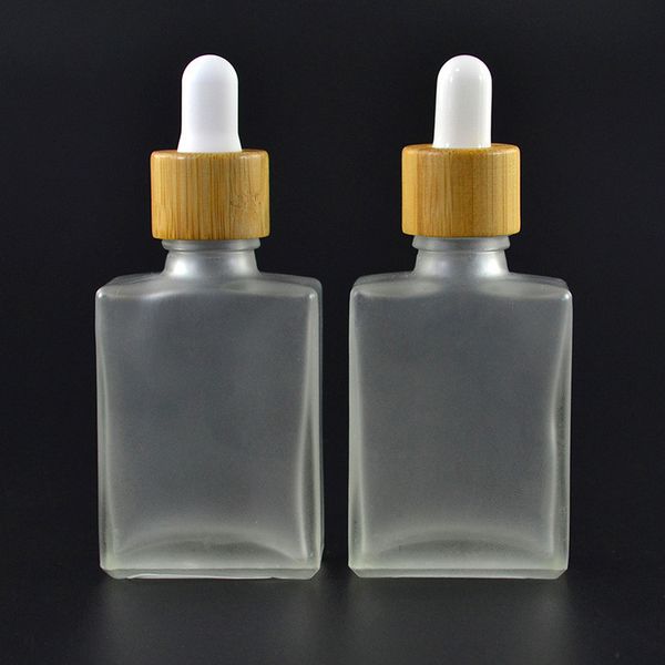 eco-friendly frosted clear square glass tincture oil bottle with bamboo dropper lid, 30ml 1oz 15ml 50ml 100ml rectangle glass essential oil
eco-friendly frosted clear square glass tincture oil bottle with bamboo dropper lid, 30ml 1oz 15ml 50ml 100ml rectangle glass essential oil