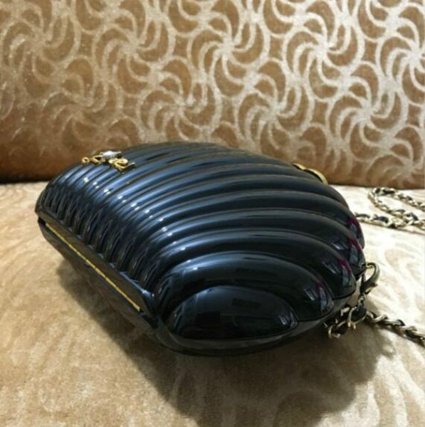 elegant ivory pearl shell wristband bag brand clutch wallet designer chain shoulder bag luxury gift purse black pearl shell handbag
elegant ivory pearl shell wristband bag brand clutch wallet designer chain shoulder bag luxury gift purse black pearl shell handbag
