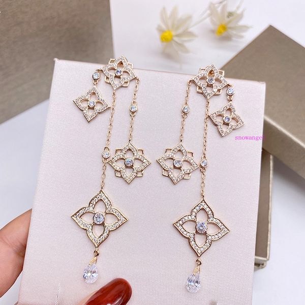 four gold four leaf flower tassel pendant earrings female 925 silver needle long earrings show thin face
four gold four leaf flower tassel pendant earrings female 925 silver needle long earrings show thin face