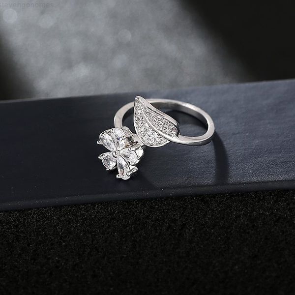 fashion vibrating sound jewelry clover rotating flower adjustable leaf female ring, Silver
fashion vibrating sound jewelry clover rotating flower adjustable leaf female ring, Silver
