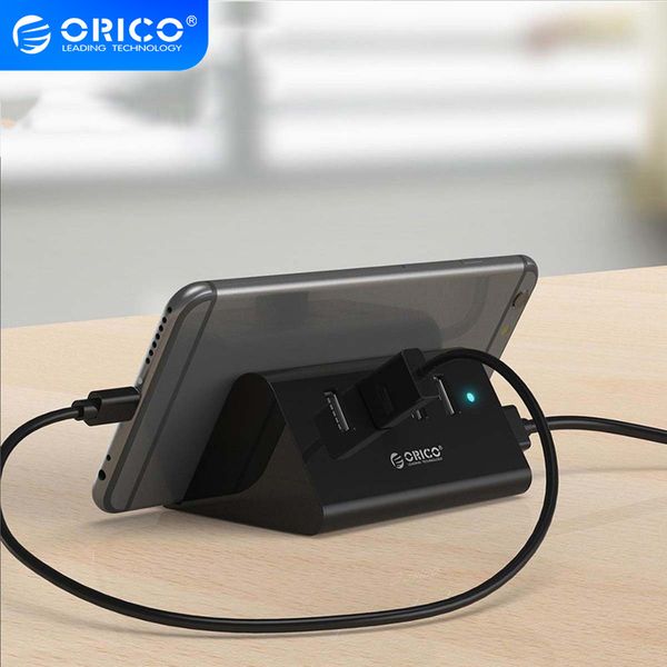 orico usb high speed mini 4 ports usb2.0/usb3.0 hub for desklapwith phone and tablet holder -black/white(shc)
orico usb high speed mini 4 ports usb2.0/usb3.0 hub for desklapwith phone and tablet holder -black/white(shc)