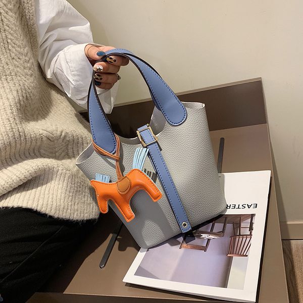 new korean versatile bucket portable vegetable basket pony decoration shoulder women's bag
new korean versatile bucket portable vegetable basket pony decoration shoulder women's bag