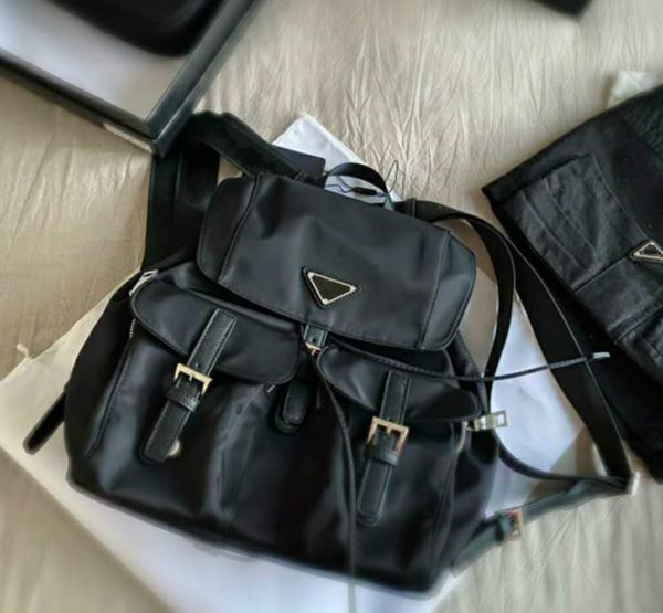 2021 luxury schoold bags designers mens black backpacks medium size fashion shoulder bags with pockets with triangle for women pd20092405