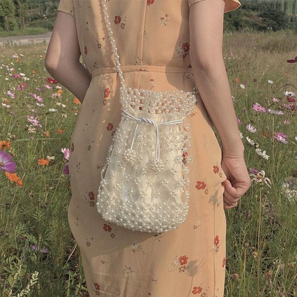 pearl bag women's messenger bag spring summer woven milky white vintage women's tapered girl's heart backpack
pearl bag women's messenger bag spring summer woven milky white vintage women's tapered girl's heart backpack