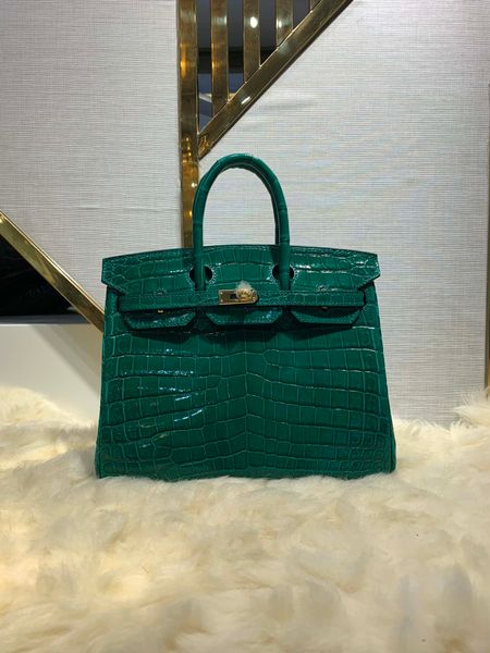 by order only wholesale green shinny crocodile purse30cm fully handmade wax thread can make other size many colors for chosen fast delivery
by order only wholesale green shinny crocodile purse30cm fully handmade wax thread can make other size many colors for chosen fast delivery