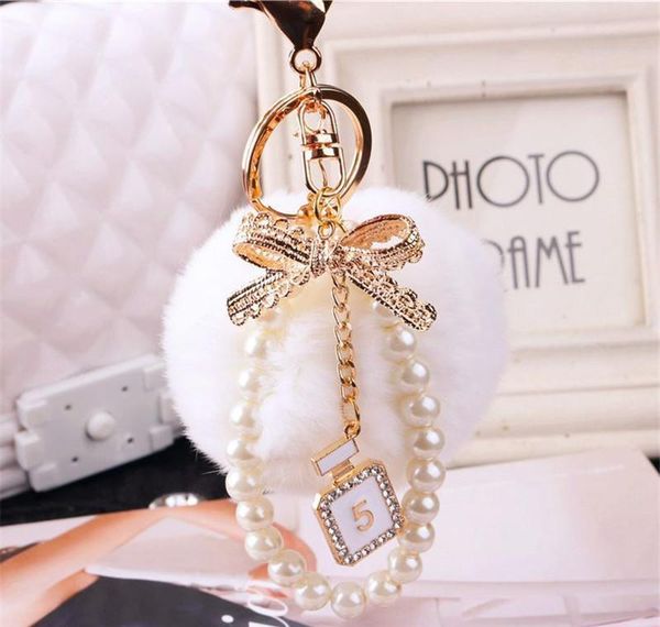 2020 fashion pearl chain crystal bottle bow pompom keychain car women handbag key chain ring fluffy puff bal jllrab ffshop2001, Silver
2020 fashion pearl chain crystal bottle bow pompom keychain car women handbag key chain ring fluffy puff bal jllrab ffshop2001, Silver