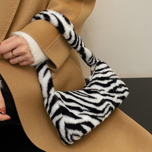 cross body small zebra print plush women's underarm bag winter style furry fur shouler tote bags ladies luxury braned mini soft armpit
cross body small zebra print plush women's underarm bag winter style furry fur shouler tote bags ladies luxury braned mini soft armpit