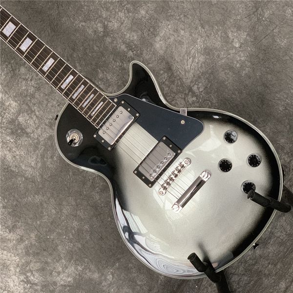electric guitar, rosewood fingerboard, silverburst color, chrome hardware, solid mahogany body electric guitar
electric guitar, rosewood fingerboard, silverburst color, chrome hardware, solid mahogany body electric guitar