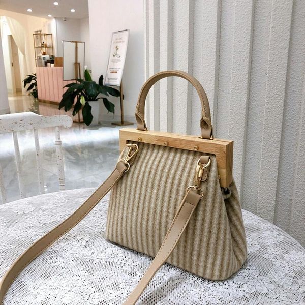 new retro wool handbag wooden handle clip bucket bag buckle women shoulder messenger bag clutch purse female
new retro wool handbag wooden handle clip bucket bag buckle women shoulder messenger bag clutch purse female