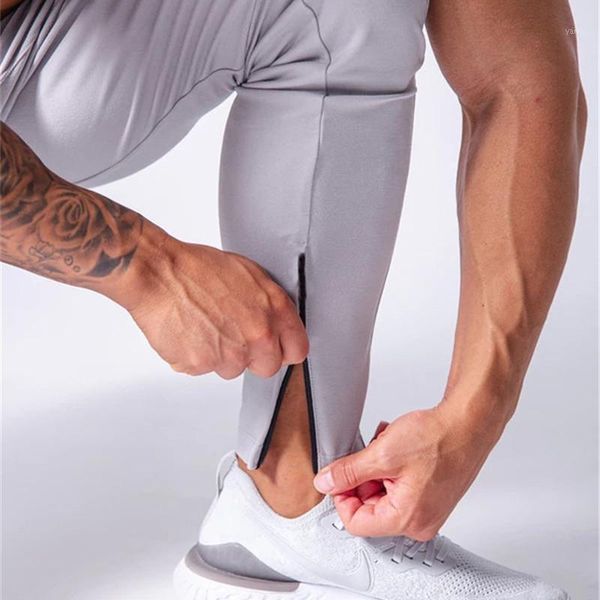 new sports pants male muscle fitness running slim breathable feet trousers lace up feet zipper men casual pants1, Black
new sports pants male muscle fitness running slim breathable feet trousers lace up feet zipper men casual pants1, Black