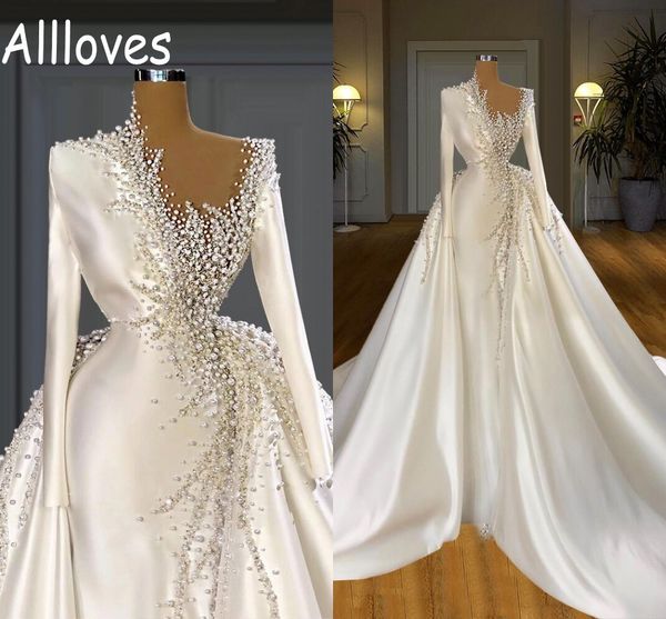 dubai saudi arabia satin overskirts wedding gowns with detachable train long sleeves sheer neck major handwork pearls beading bridal vestido, White
dubai saudi arabia satin overskirts wedding gowns with detachable train long sleeves sheer neck major handwork pearls beading bridal vestido, White