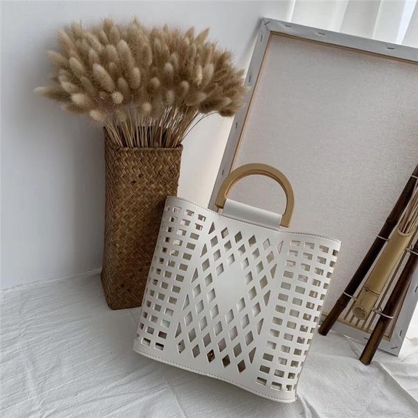 women bags handbags 2020 famous brands hollow out beach bag bolsa feminina wood handle tote bags pu leather shoulder bag purses
women bags handbags 2020 famous brands hollow out beach bag bolsa feminina wood handle tote bags pu leather shoulder bag purses