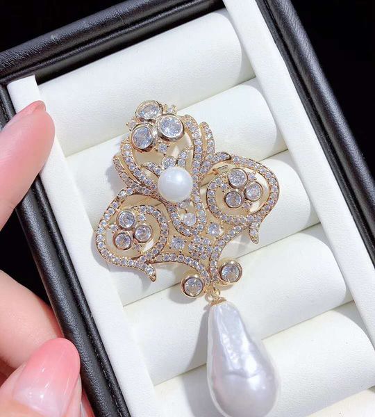 white sea shell pearl gold plated cubic zirconia micro pave flower brooch 201009, Gray
white sea shell pearl gold plated cubic zirconia micro pave flower brooch 201009, Gray