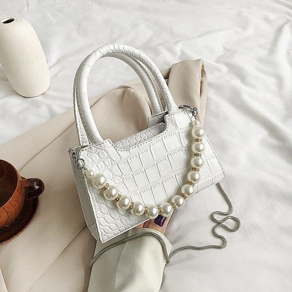 2020 summer simple mini pearl design messenger bag women's handbag women travel solid color white messenger bag
2020 summer simple mini pearl design messenger bag women's handbag women travel solid color white messenger bag
