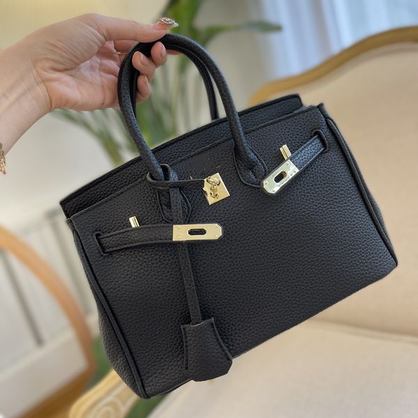 two sizes of 25cm and 35cm luxury designer bags pure black genuine leather shoulder bag totes portable wallet with golden letters
two sizes of 25cm and 35cm luxury designer bags pure black genuine leather shoulder bag totes portable wallet with golden letters