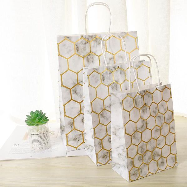 10 pcs/lot 25*18*10cm bronzing printed marble gift paper bags with handles for packaging decoration festival wedding party1
10 pcs/lot 25*18*10cm bronzing printed marble gift paper bags with handles for packaging decoration festival wedding party1