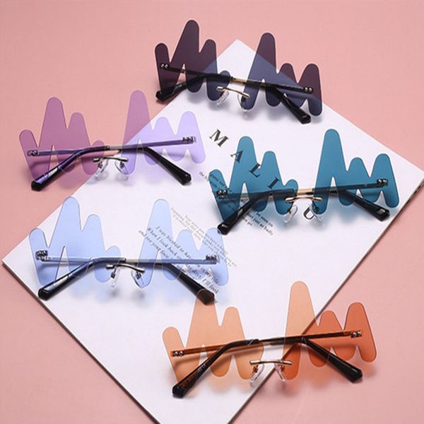 personality wave rimless sunglasses women brand fashion punk sun female frameless blue curved glasses uv400
personality wave rimless sunglasses women brand fashion punk sun female frameless blue curved glasses uv400
