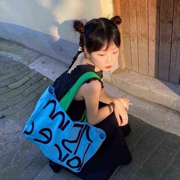 shopping bags women alphabet canvas shoulder female casual letter printed tote personality handbags large capacity school bag 220307
shopping bags women alphabet canvas shoulder female casual letter printed tote personality handbags large capacity school bag 220307
