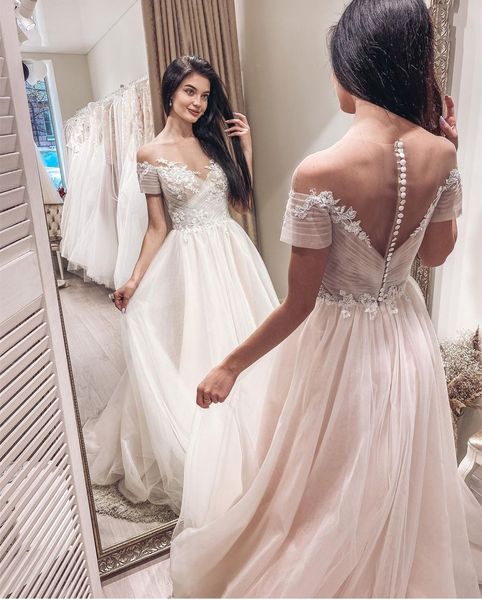 fake off shoulder bohemian wedding dresses a line appliques lace sheer neck buttons back long bridal gown country beach wedding dress 2021, White
fake off shoulder bohemian wedding dresses a line appliques lace sheer neck buttons back long bridal gown country beach wedding dress 2021, White