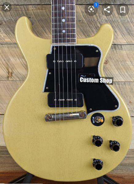 double cutaway junior 1959 special tv yellow electric guitar black pickguard, black p-90 pickups, wrap arround tailpiece, vintage tuners
double cutaway junior 1959 special tv yellow electric guitar black pickguard, black p-90 pickups, wrap arround tailpiece, vintage tuners