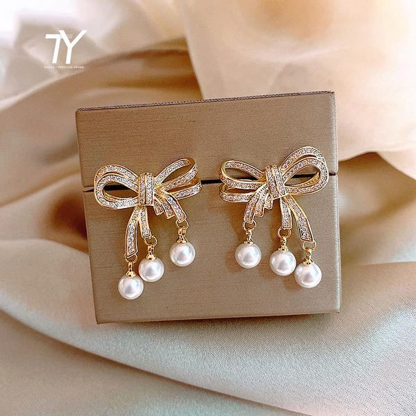 dangle & chandelier heavy industry luxury zircon pearl bow earrings elegant women jewelry fashion party temperament ladies christmas, Silver
dangle & chandelier heavy industry luxury zircon pearl bow earrings elegant women jewelry fashion party temperament ladies christmas, Silver