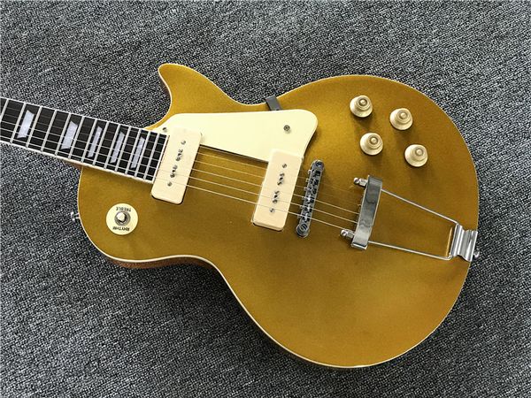 1956 gold goldelectric guitar wrap arround tailpiece, white p90 pickups, china oem music instrument
1956 gold goldelectric guitar wrap arround tailpiece, white p90 pickups, china oem music instrument