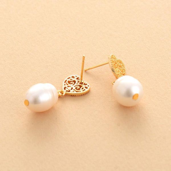 premium pearl серьги женщины пресноводное жемчужное сердце форма серьса серьги изысканные леди классические элегантные ювелирные изделия ден, Golden
premium pearl серьги женщины пресноводное жемчужное сердце форма серьса серьги изысканные леди классические элегантные ювелирные изделия ден, Golden